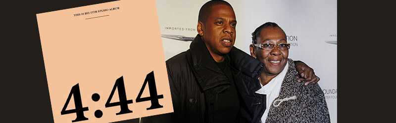 A photo of Jay-Z and his mother with the cover of his album 4:44