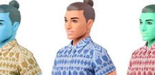 A photos of three Ken dolls that have. a man bun. One is tan, one is blue and one is green