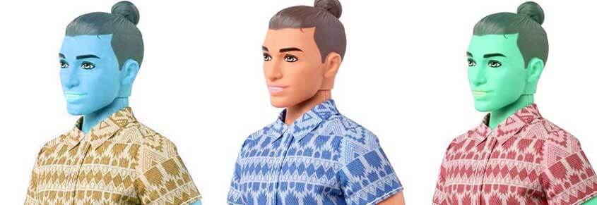 A photos of three Ken dolls that have. a man bun. One is tan, one is blue and one is green