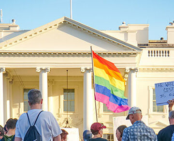 A photo of people protesting for trans rights outside of the White House