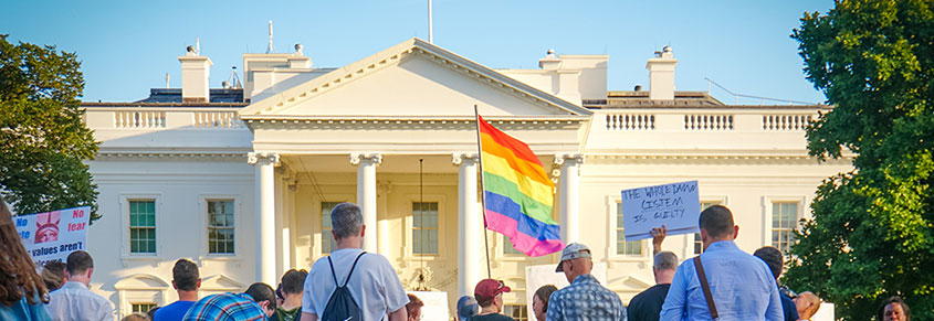 A photo of people protesting for trans rights outside of the White House