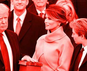 A photo of Donald Trump being sworn in as President with Melania Trump and his children near him.