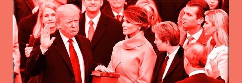 A photo of Donald Trump being sworn in as President with Melania Trump and his children near him.