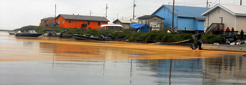 A photo of f Kivalina, Alaska, which shows flooding around houses