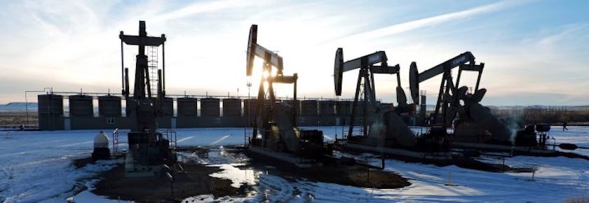 A photo of machines drilling for oil in a wintery area.