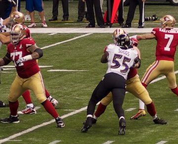 A photo of people playing football, including Colin Kaepernick's team.