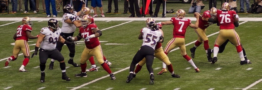 A photo of people playing football, including Colin Kaepernick's team.