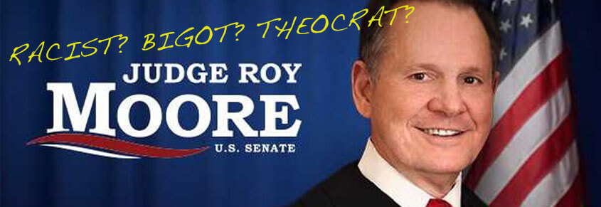 A campaign sign for Roy Moore with vandalization on it that says, "Racist? Bigot? Theocrat?"
