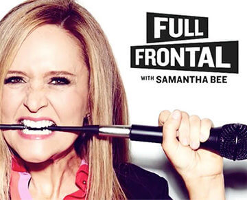 A promotional photo of Samantha Bee biting into a microphone cord for her show "Full Frontal with Samantha Bee"