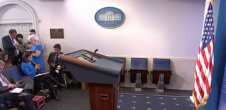 A photo of the White House press room. The podium is empty.
