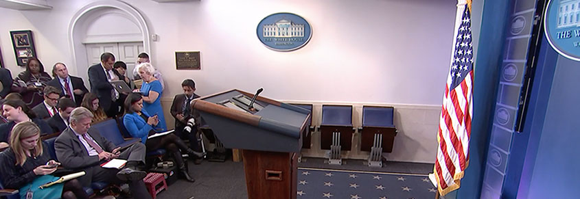 A photo of the White House press room. The podium is empty.
