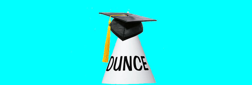 A collage of a graduation cap on top of a sign that says "dunce."