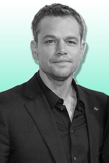 A photo of Matt Damon and someone holding a microphone up to him