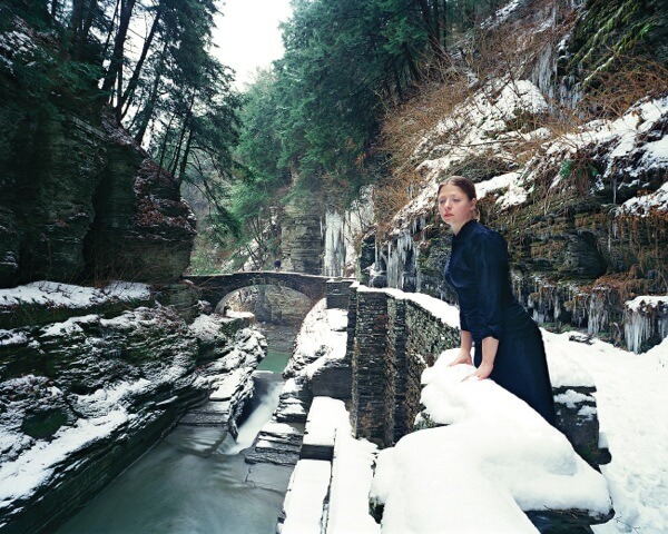 A photo of a woman in a snowy area