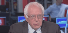 A photo of Bernie Sanders speaking on television