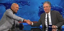 A photo of Jon Stewart and Common on The Daily Show