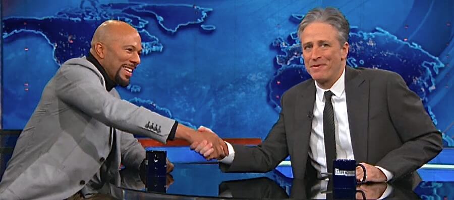 A photo of Jon Stewart and Common on The Daily Show