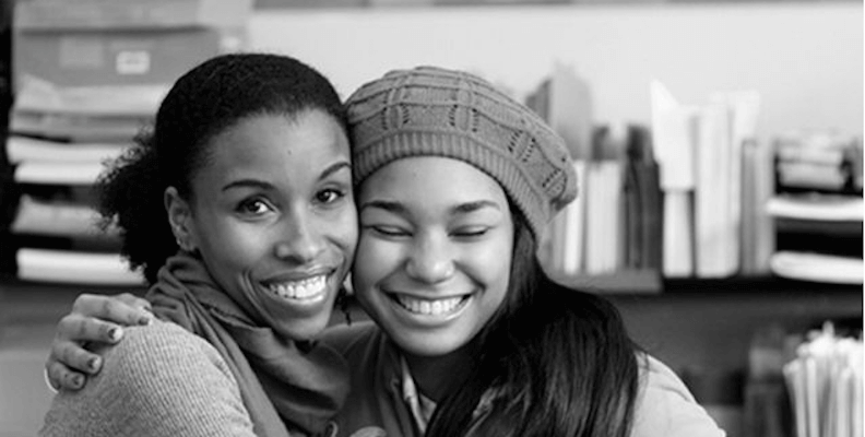 A photo of a Black woman and a Black teenager