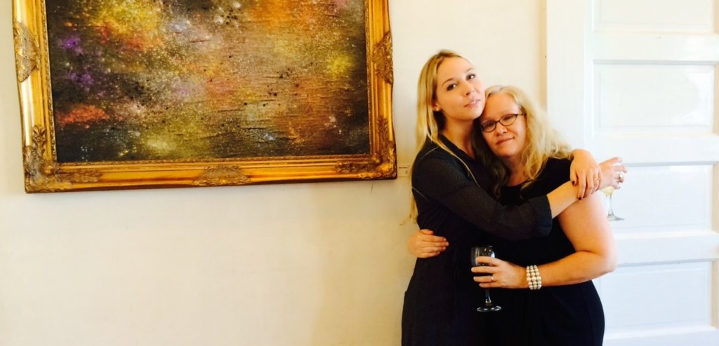 A photo of a white woman hugging her mother