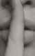 A photo of a woman with a finger of her lips making a shush sign.