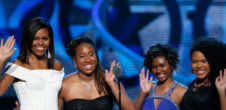 First Lady Michelle Obama, left, waves while standing on stage with Making A Difference award winners, from left, Kaya Thomas, Chental-Song Bembry and Gabrielle Jordan during a taping of the Black Girls Rock award ceremony at the New Jersey Performing Arts Center,