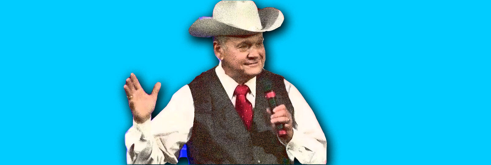 A photo of Roy Moore speaking into a microphone