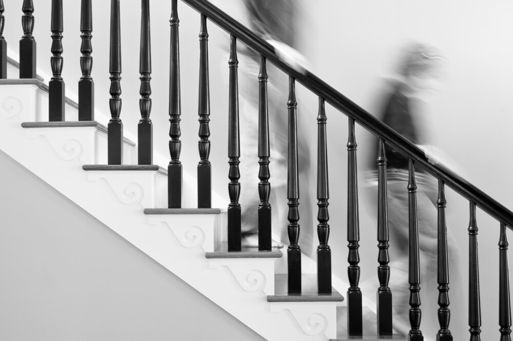A photo of people going down the stairs. The people are blurry.