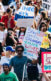 A photo from a protest support DACA. Posters have messages like "United and Strong," "Stay Strong Dreamers. You Are Loved And Wanted," and "Los Angeles Stands With Dreamers."