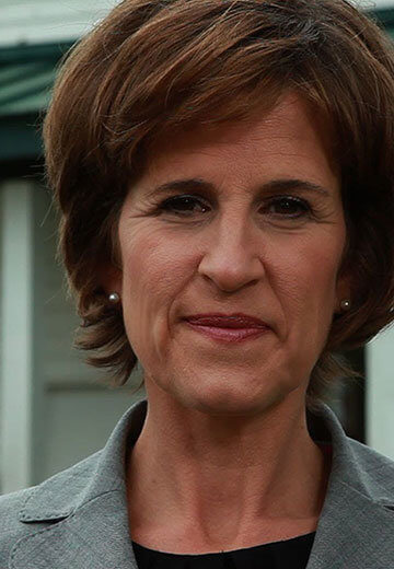 A photo of Rebecca Otto outside of her home.