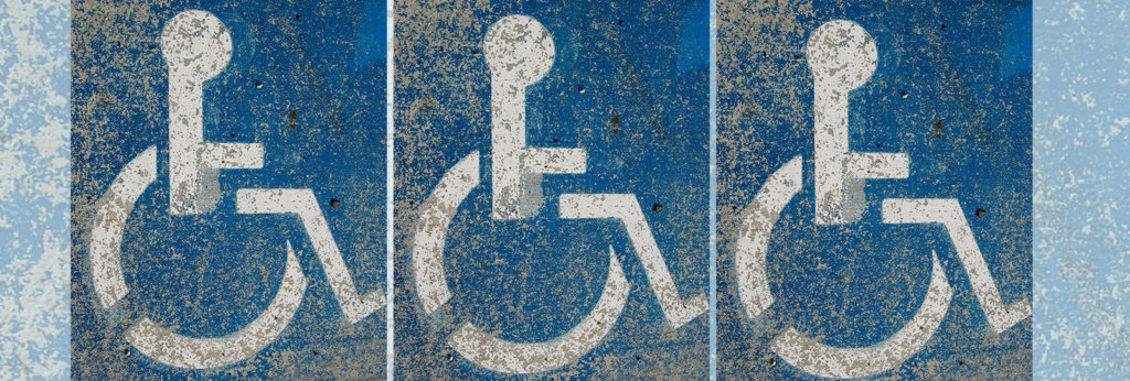 A photo of a fading handicap sign
