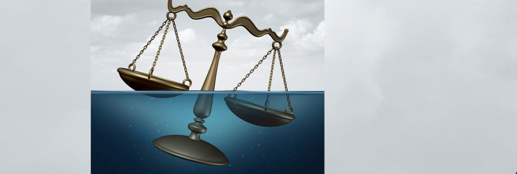 An illustration of the scales of justice going underwater