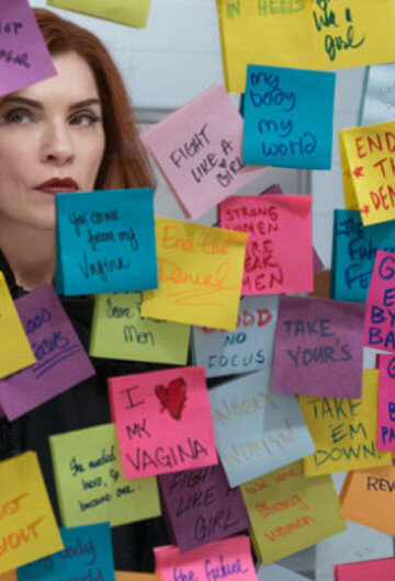 A still from the series "Dietland" with a woman with red hair looking at post-it notes.