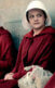 A still from the show, "The Handmaid's Tail." Women are wearing red robes and white bonnets.