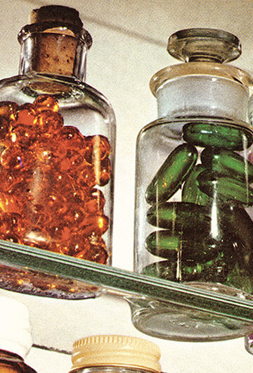 A photo of pills on a shelf.