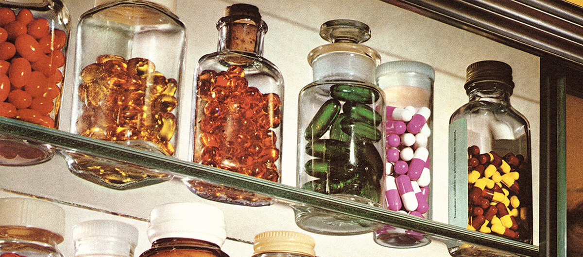A photo of pills on a shelf.