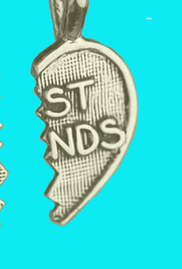 A necklace that says "Best Friends" that is ripped in half.