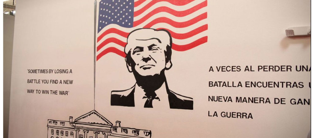 Artwork honoring Donald Trump with an American flag behind him