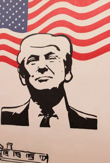Artwork honoring Donald Trump with an American flag behind him