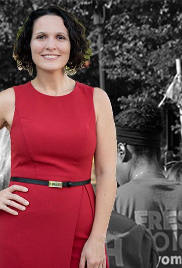 A photo of Sarah Stankorb, a white woman with brown hair wearing a red dress