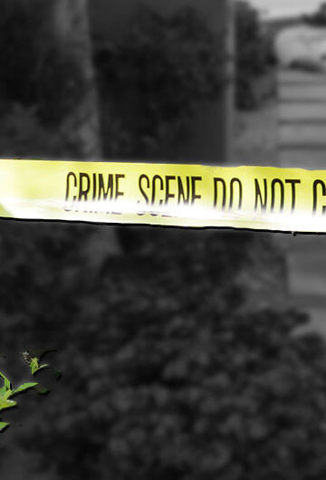 A photo of a street outside with a "Crime Scene Do Not Cross" rope set up.