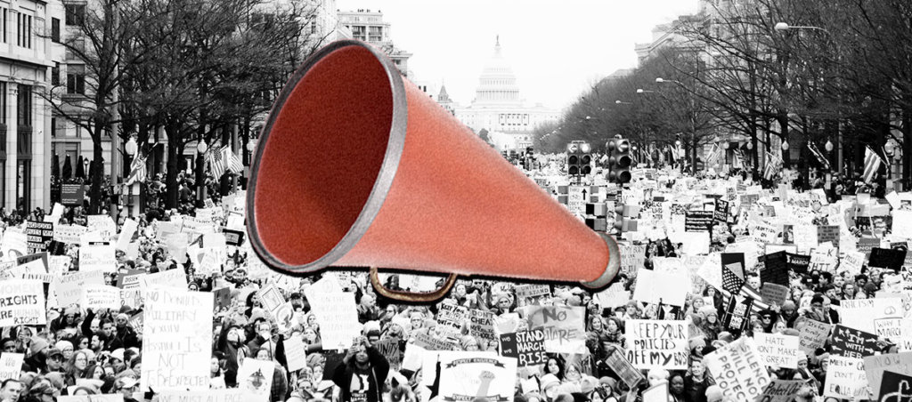 A megaphone on top of a photo of people protesting for women's rights.