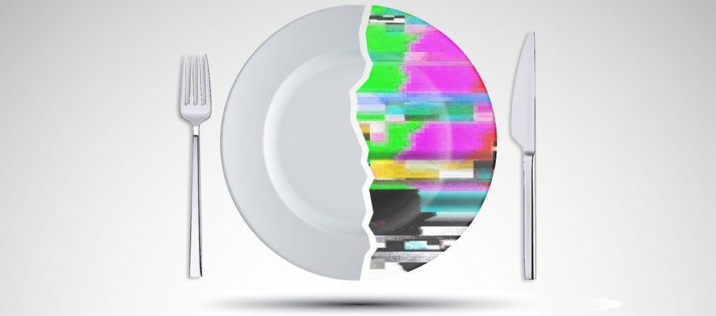 A photo of a plate and a fork and a knife. Half of the plate looks like it's glitching.