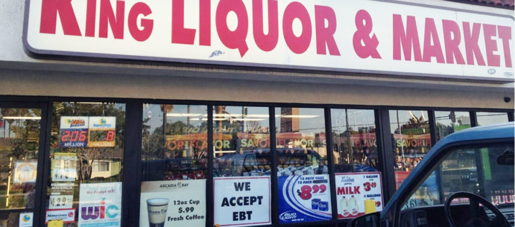 A photo of the front of "King Liquor & Market" store