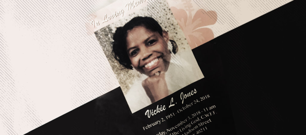 A pamphlet that says "In Loving Memory, Vickie L. Jones, February 2, 1951-October 24, 2018." There is also a photo of a Black woman smiling on the cover of the pamphlet.