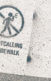 A photo of a sign that ays, "No catcalling on the sidewalk"