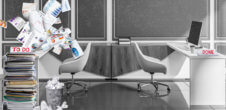 A photo of an office. On one desk, it is clear and says "Done." On the other side, there is a pile of overflowing work with the sign "to do" on it.