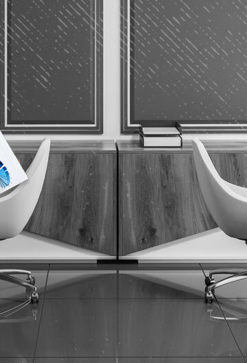 A photo of an office. On one desk, it is clear and says "Done." On the other side, there is a pile of overflowing work with the sign "to do" on it.