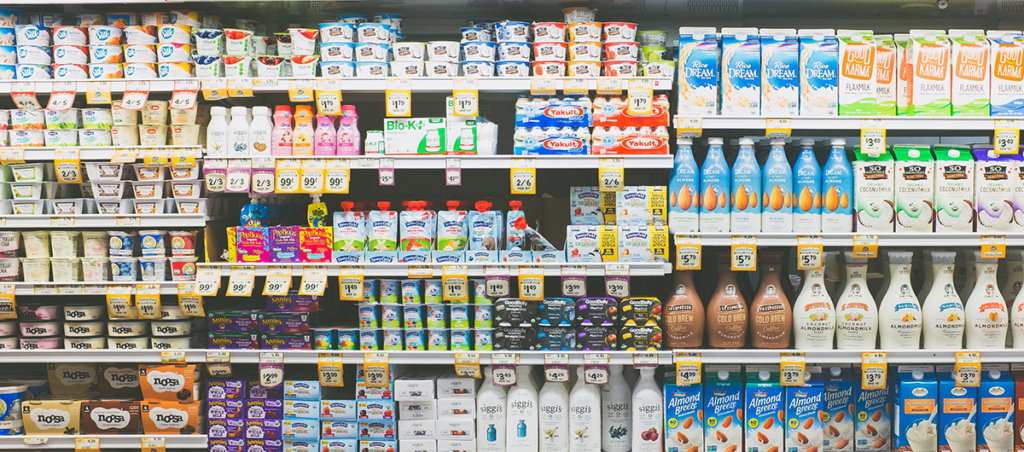 A photo of a dairy section in a grocery store.