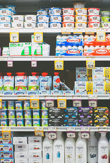 A photo of a dairy section in a grocery store.