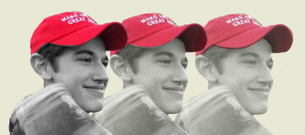 A photo of Nick Sandmann, a white teenager, wearing a Make America Great Again hat.